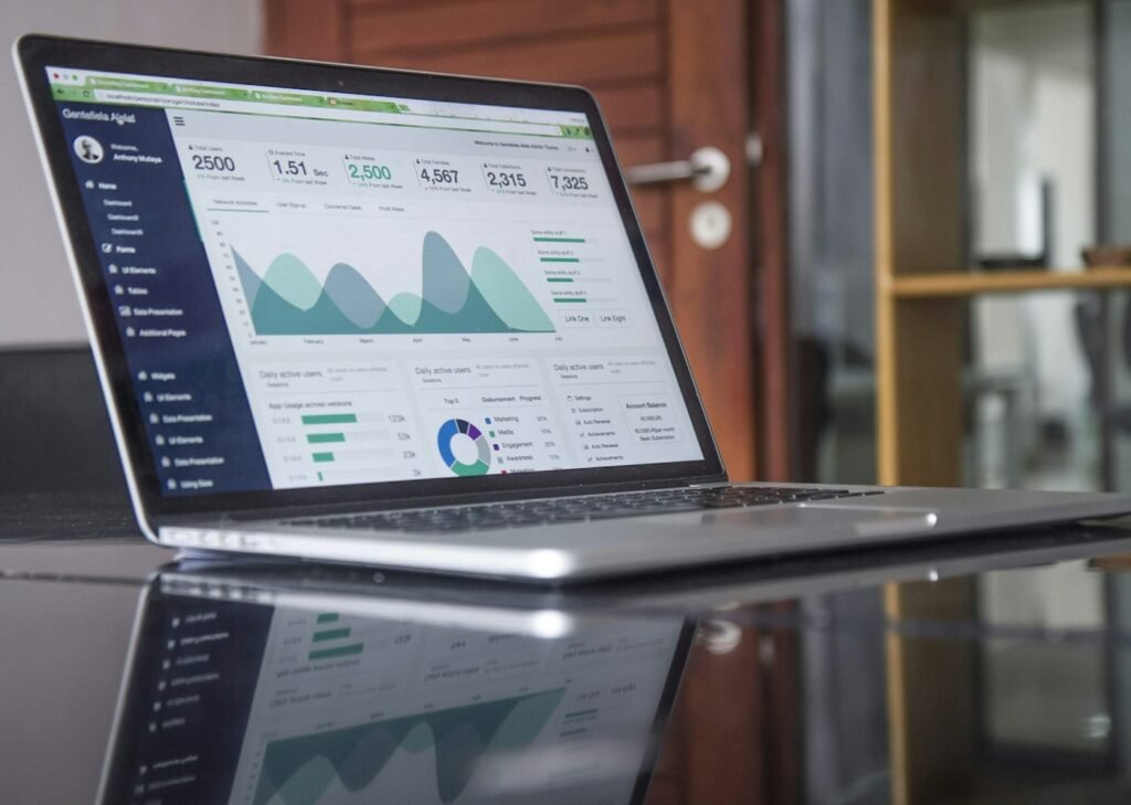 Marketer reviewing campaign analytics on a laptop